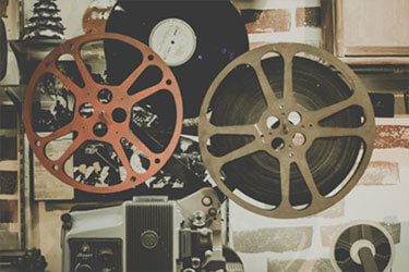 Photo: Film running through a projector